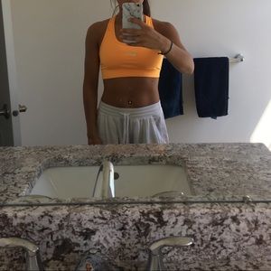 Bright orange Nike sports bra